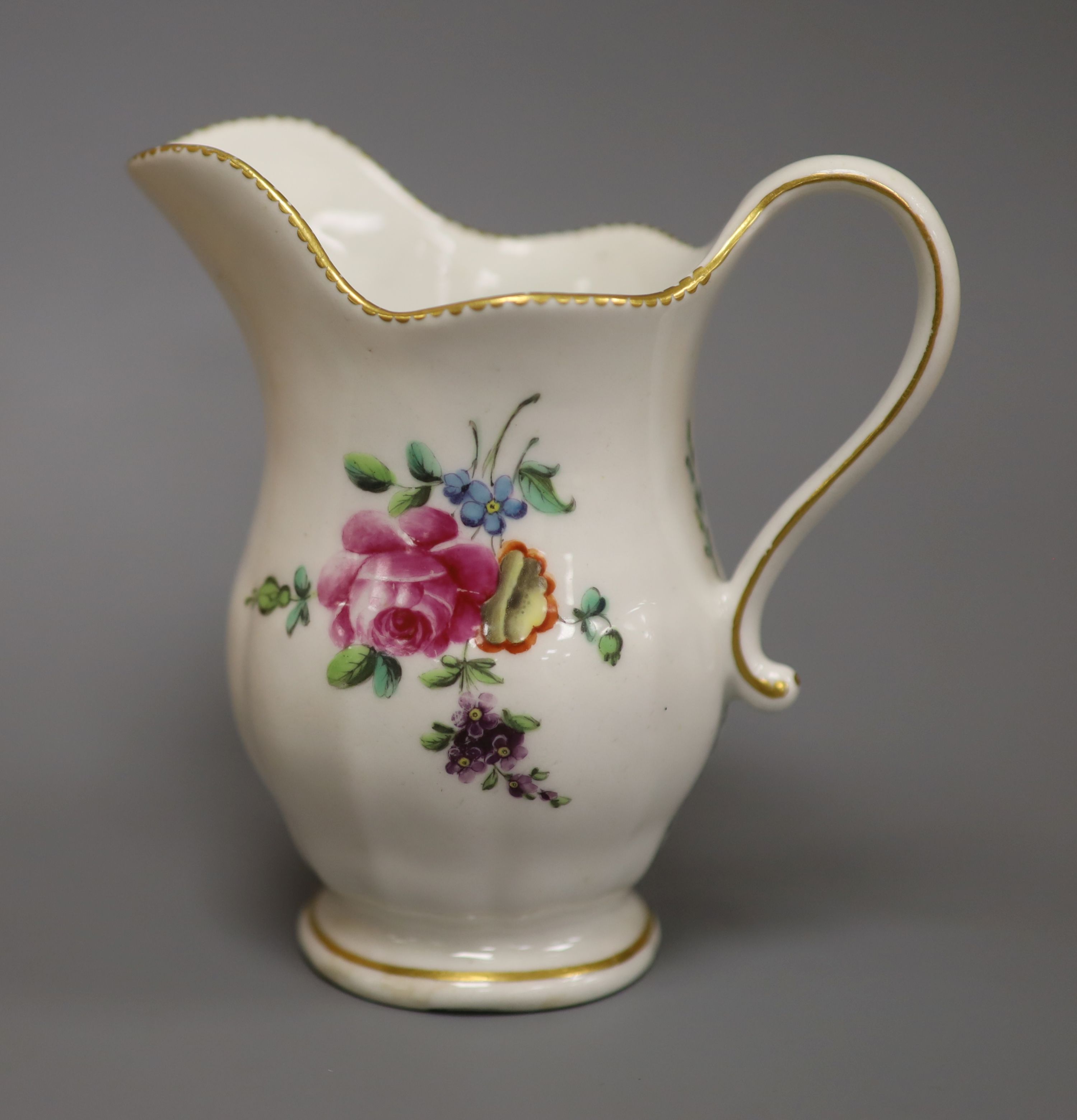 A Derby moulded jug, painted with flowers in manner of Edward Withers, c.1772, height 12cm